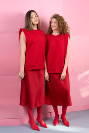 Red sleeveless sweatshirt with detachable prints