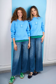 Light blue sweatshirt with detachable print